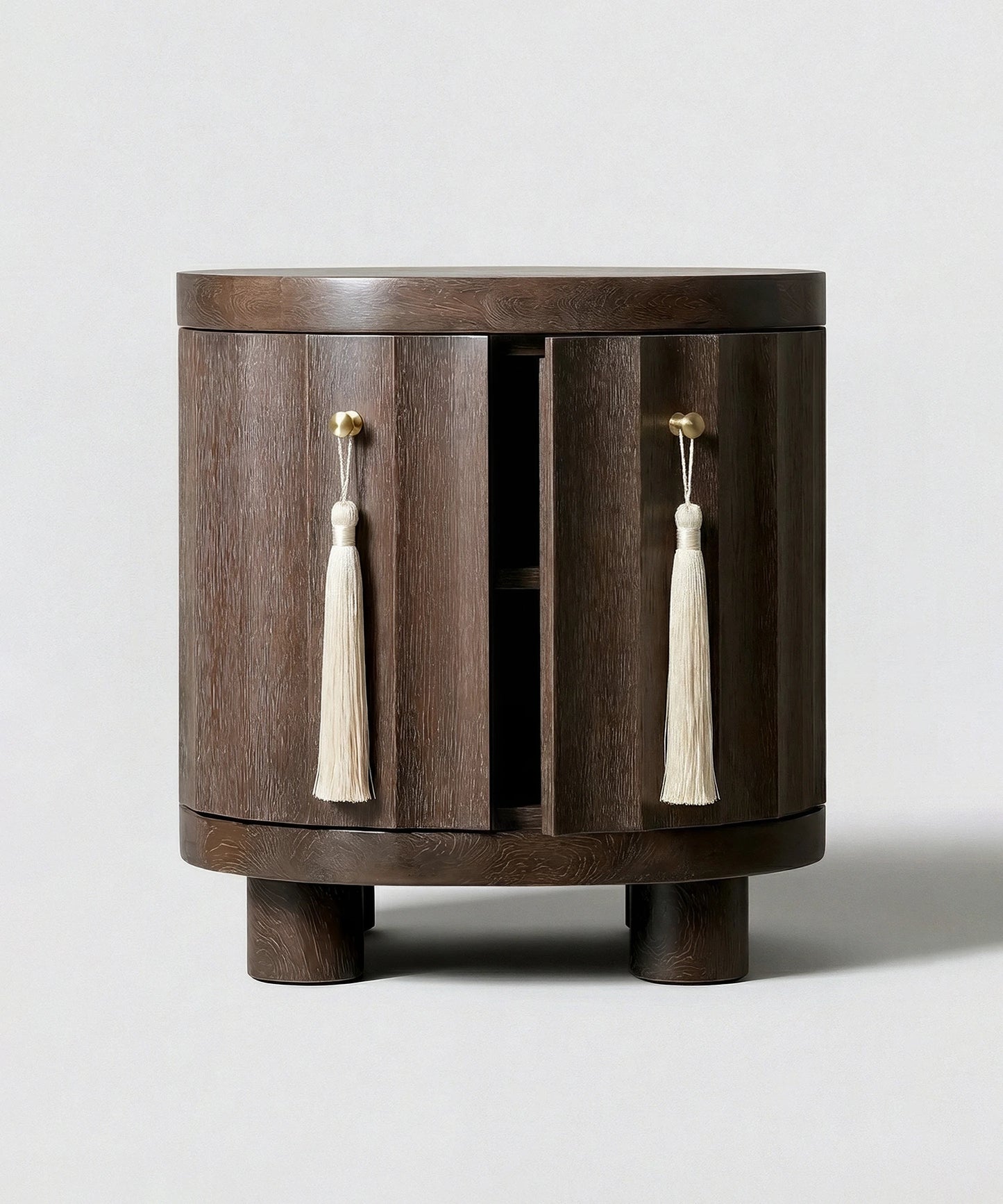 Wooden side table with tassel decorations on a white background