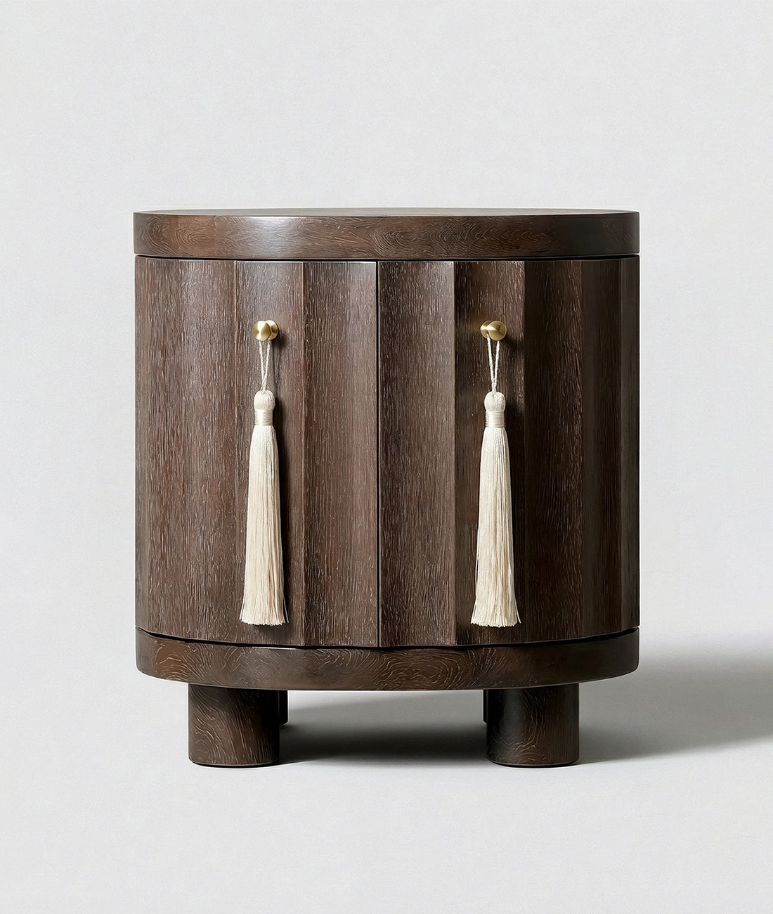 Wooden side table with tassel decorations on a white background